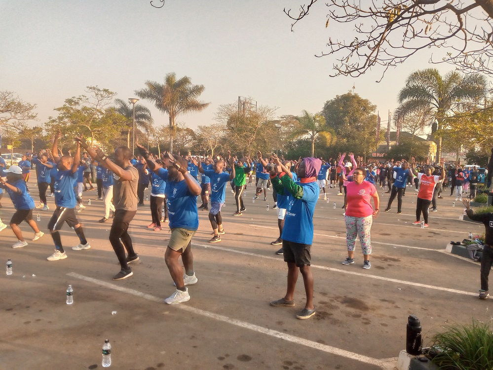 A cross section of aerobic enthusiasts lined for the exercise